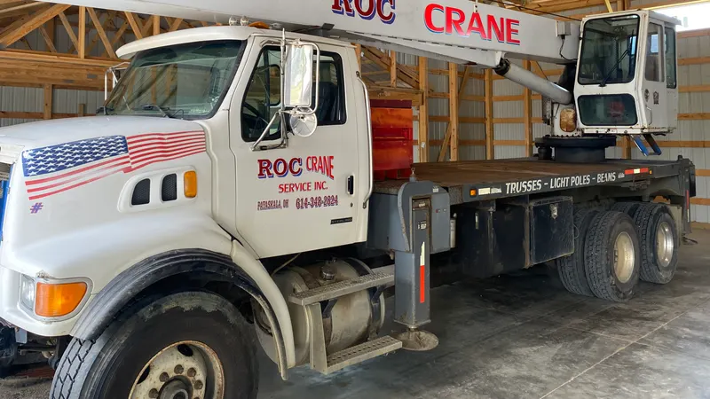 ROC Crane's 30 ton boom truck, with the operator's swing cab mounted beside the boom.